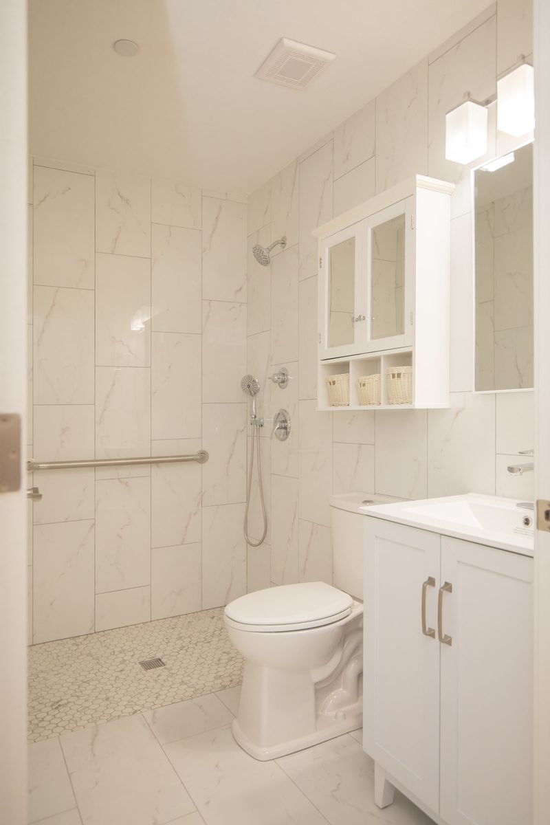 Accessible bathroom with walk-in shower and grab bars