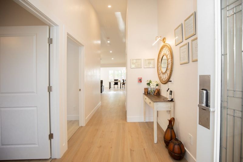 Bright entry hallway with a console table and mirror